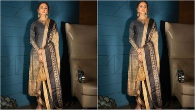 Her kurta outfit features a gold embroidered neckline, straight fit, blue and beige ombre print and full sleeves. She paired it with a golden chudidar pant and a matching duppata with an enchanting print and intricate golden borders. (Instagram/@rakulpreet) Her kurta outfit features a gold embroidered neckline, straight fit, blue and beige ombre print and full sleeves. She paired it with a golden chudidar pant and a matching duppata with an enchanting print and intricate golden borders. (Instagram/@rakulpreet)