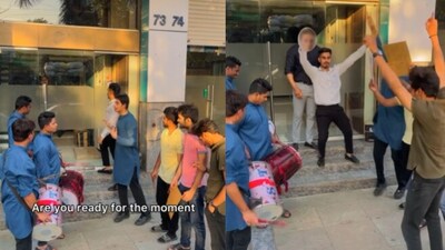 Man and his friends dancing outside his office. Man and his friends dancing outside his office.