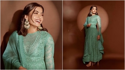Lastly, Rashmika chose darkened brows, shimmering brown eye shadow, winged eyeliner, smudged kohl, mascara on the lashes, a green bindi, highlighter on the contours, blush on the cheeks, and bright mauve lip shade for the glam picks. Centre-parted half-up, half-down hairdo styled with loose strands sculpting her face and wavy ends rounded off the look. (Instagram) Lastly, Rashmika chose darkened brows, shimmering brown eye shadow, winged eyeliner, smudged kohl, mascara on the lashes, a green bindi, highlighter on the contours, blush on the cheeks, and bright mauve lip shade for the glam picks. Centre-parted half-up, half-down hairdo styled with loose strands sculpting her face and wavy ends rounded off the look. (Instagram)
