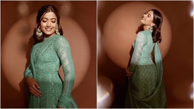 Rashmika wore the kurta with matching mint green churidar pants and a tissue silk dupatta adorned with thread-embroidered borders and scalloped trims. She accessorised the ensemble with gold Kolhapuri block heels and jewels from the label Amaris by Prerna Rajpal. She wore statement earrings and an ornate ring. (Instagram) Rashmika wore the kurta with matching mint green churidar pants and a tissue silk dupatta adorned with thread-embroidered borders and scalloped trims. She accessorised the ensemble with gold Kolhapuri block heels and jewels from the label Amaris by Prerna Rajpal. She wore statement earrings and an ornate ring. (Instagram)