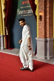 Munawar Faruqui shines in white at Heeramandi screening Munawar Faruqui shines in white at Heeramandi screening