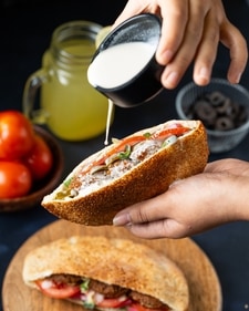A type of Ka'ak sandwich paired with falafel A type of Ka'ak sandwich paired with falafel