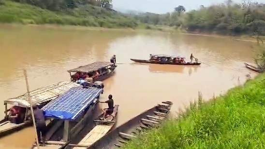 Polling officials leave on boats after collecting the (Electronic Voting Machines) EVMs, (Voter-Verified Paper Audit Trails) VVPATs and other polling materials, in Pherzawl, Manipur.(PTI)