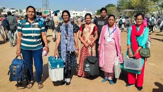 Polling officials on their way to their booths, in Chittorgarh, Rajasthan.(ANI)