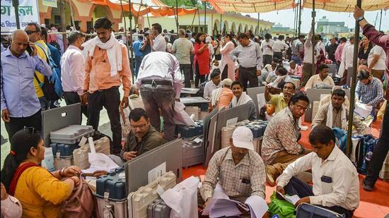 Officials collect election material in Mathura on Thursday. (PTI PHOTO)