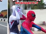 Delhi's 'Spiderman' couple faces charges including driving without a helmet, license, and displaying a number plate. Delhi's 'Spiderman' couple faces charges including driving without a helmet, license, and displaying a number plate.