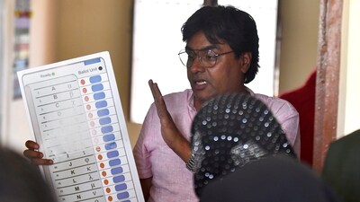 A polling official demonstrates the voting process at Dadri in Gautam Buddha Nagar District, Uttar Pradesh. (Jitender Gupta / ANI) A polling official demonstrates the voting process at Dadri in Gautam Buddha Nagar District, Uttar Pradesh. (Jitender Gupta / ANI)