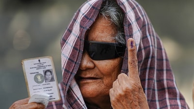 An elderly woman shows her finger marked with indelible ink and her Voter ID card in Bengaluru, Karnataka. (Shailendra Bhojak / PTI) An elderly woman shows her finger marked with indelible ink and her Voter ID card in Bengaluru, Karnataka. (Shailendra Bhojak / PTI)