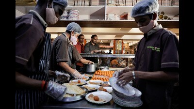 A restaurant in Bengaluru served dosas free of cost to voters during the second phase of LS elections, on Friday. (REUTERS) A restaurant in Bengaluru served dosas free of cost to voters during the second phase of LS elections, on Friday. (REUTERS)