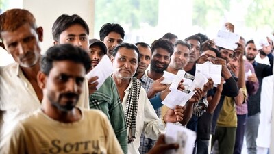 Voters queue to vote at a polling station during the second phase of the Lok Sabha Polls at Dadri in Gautam Buddha Nagar District, Uttar Pradesh, on Friday. (ANI) Voters queue to vote at a polling station during the second phase of the Lok Sabha Polls at Dadri in Gautam Buddha Nagar District, Uttar Pradesh, on Friday. (ANI)