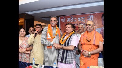 BJP Chandigarh candidate Sanjay Tandon with party’s Uttarakhand chief and Rajya Sabha MP Mahendra Bhatt at an event on Friday. (HT Photo) BJP Chandigarh candidate Sanjay Tandon with party’s Uttarakhand chief and Rajya Sabha MP Mahendra Bhatt at an event on Friday. (HT Photo)