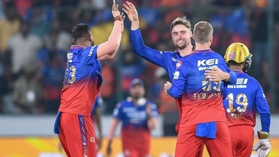 Royal Challengers Bengaluru's Will Jacks (C) celebrates with teammates after taking the wicket of Sunrisers Hyderabad's Travis Head (AFP) Royal Challengers Bengaluru's Will Jacks (C) celebrates with teammates after taking the wicket of Sunrisers Hyderabad's Travis Head (AFP)