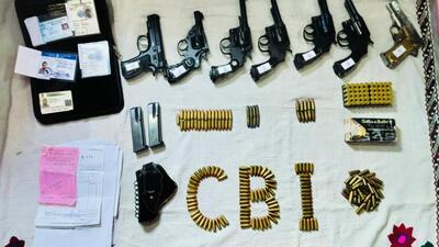 During the searches weapons including three foreign-made revolvers, one Indian revolver, one Colt official police revolver, one foreign-made pistol, one countrymade pistol, 120 bullets of 9mm, 50 cartridges of .45 calibre, 120 cartridges of 9mm etc, were recovered (Twitter Photo) During the searches weapons including three foreign-made revolvers, one Indian revolver, one Colt official police revolver, one foreign-made pistol, one countrymade pistol, 120 bullets of 9mm, 50 cartridges of .45 calibre, 120 cartridges of 9mm etc, were recovered (Twitter Photo)