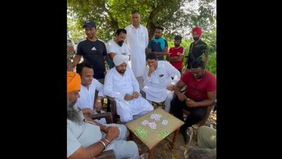 Former Punjab chief minister Charanjit Singh Channi also had lunch with the villagers of Billi Charumi village in Nakodar assembly segment on Friday during his campaign tour. (HT File)
