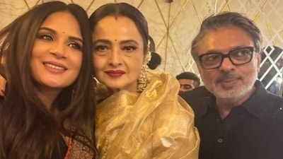 Rekha poses with Richa Chadha and Sanjay Leela Bhansali at Heeramandi premiere. Rekha poses with Richa Chadha and Sanjay Leela Bhansali at Heeramandi premiere.