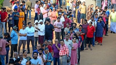 People queue up to vote during the second round of voting in the six-week long national election outside a polling booth in Bengaluru, India, Friday, April 26, 2024. (AP Photo) (AP) People queue up to vote during the second round of voting in the six-week long national election outside a polling booth in Bengaluru, India, Friday, April 26, 2024. (AP Photo) (AP)
