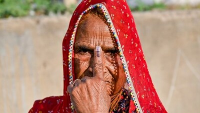 An elderly woman shows her ink-marked finger after casting her vote for the second phase of Lok Sabha elections, in Ajmer. (PTI) An elderly woman shows her ink-marked finger after casting her vote for the second phase of Lok Sabha elections, in Ajmer. (PTI)