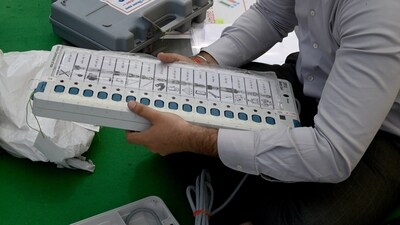 A polling official checks an EVM machine ahead of the second phase of voting in Noida, Uttar Pradesh. (HT Photo) A polling official checks an EVM machine ahead of the second phase of voting in Noida, Uttar Pradesh. (HT Photo)