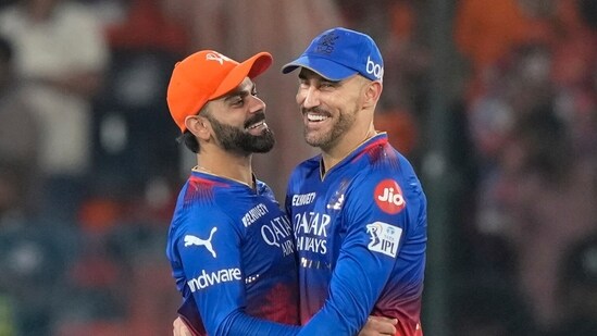 Royal Challengers Bengaluru's Virat Kohli, left, and Faf du Plessis celebrate their win against Sunrisers Hyderabad during the Indian Premier League in Hyderabad, India, Thursday (AP)