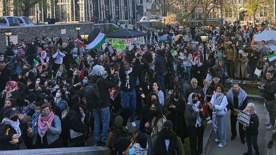 Students at the City College of New York protest the Israel-Hamas war on the campus in the Harlem neighborhood of New York, Thursday, April 25, 2024 (AP Photo/Jake Offenhartz) (AP)