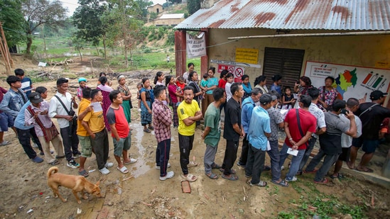 Voters wait to cast their votes for the second phase of of Lok Sabha elections, at Kanchanpur village of North Tripura district.(PTI)