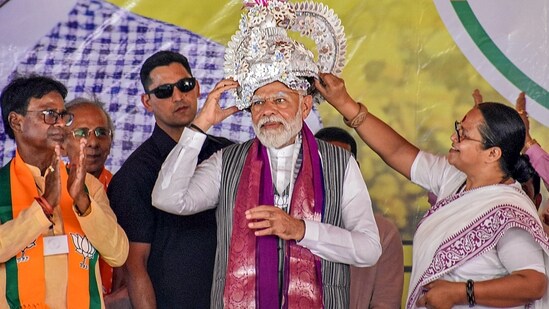 Prime Minister Narendra Modi being presented a crown during a Lok Sabha elections rally in Malda on Friday. (PTI)