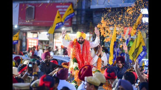 Punjab CM Bhagwant Mann addresses supporters during an election roadshow in Jalandhar on Friday. (PTI)