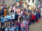 People queue up to vote during the second round of voting in the Lok Sabha elections. (AP)
