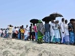 Voters stand in a queue to cast their ballot outside a polling station during the second phase of voting for the India's general election at Gashbari village in Darrang district of Assam. (AFP) Voters stand in a queue to cast their ballot outside a polling station during the second phase of voting for the India's general election at Gashbari village in Darrang district of Assam. (AFP)