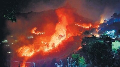 A fire tears through a forest near Saterakhal village in Rudraprayag district of Uttarakhand. (PTI) A fire tears through a forest near Saterakhal village in Rudraprayag district of Uttarakhand. (PTI)