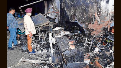 The gutted showroom near Dholewal Chowk in Ludhiana on Saturday. (Manish/HT)