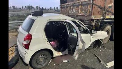 The mangled remains of the car that rammed into a stationary truck on NH-152D near Mohna village in Kaithal. (HT Photo)