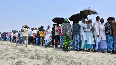 Voters stand in a queue to cast their ballot outside a polling station during the second phase of voting for the India's general election at Gashbari village in Darrang district of Assam. (AFP) Voters stand in a queue to cast their ballot outside a polling station during the second phase of voting for the India's general election at Gashbari village in Darrang district of Assam. (AFP)