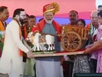 Belagavi: Prime Minister Narendra Modi being presented a memento during a public meeting for the Lok Sabha polls. 
