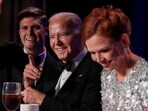 Host Colin Jost, U.S. President Joe Biden and NBC News White House senior correspondent Kelly O'Donnell attend the White House Correspondents' Association Dinner in Washington, U.S., April 27, 2024. REUTERS/Tom Brenner