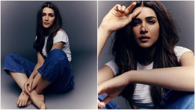 Her first look showcased minimalist fashion as she wore a white cropped top with horizontal lines. She teamed it with a pair of dark blue denim trousers that perfectly complemented her top, making her outfit ideal for summer. (Instagram/@kritisanon) Her first look showcased minimalist fashion as she wore a white cropped top with horizontal lines. She teamed it with a pair of dark blue denim trousers that perfectly complemented her top, making her outfit ideal for summer. (Instagram/@kritisanon)