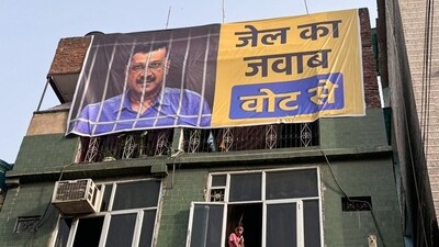 A poster of Delhi Chief Minister Arvind Kejriwal, who was arrested in connection with a money laundering probe linked to the Delhi liquor policy case.