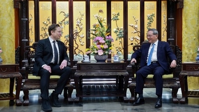 In this photo released by Xinhua News Agency, visiting Tesla founder and CEO Elon Musk, left, meets with Chinese Premier Li Qiang in Beijing, Sunday, April 28, 2024. (AP) In this photo released by Xinhua News Agency, visiting Tesla founder and CEO Elon Musk, left, meets with Chinese Premier Li Qiang in Beijing, Sunday, April 28, 2024. (AP)
