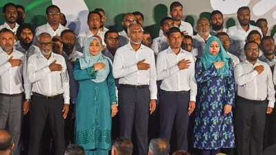 Maldives' President Mohamed Muizzu (C) stands during the national salute at a rally to celebrate the victory in the parliamentary elections, in Male on April 22, 2024. A landslide parliamentary election victory for the Maldives' pro-China president clears the way for him to redraw the physical and geopolitical map of his strategically-located Indian Ocean archipelago in Beijing's favour, diplomats and analysts say. (Photo by Mohamed Afrah / AFP) (AFP) Maldives' President Mohamed Muizzu (C) stands during the national salute at a rally to celebrate the victory in the parliamentary elections, in Male on April 22, 2024. A landslide parliamentary election victory for the Maldives' pro-China president clears the way for him to redraw the physical and geopolitical map of his strategically-located Indian Ocean archipelago in Beijing's favour, diplomats and analysts say. (Photo by Mohamed Afrah / AFP) (AFP)