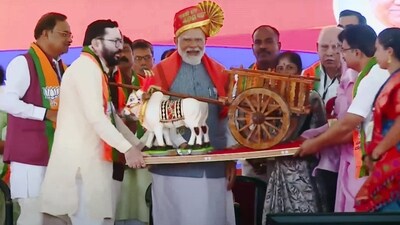Belagavi: Prime Minister Narendra Modi being presented a memento during a public meeting for the Lok Sabha polls. (PTI) Belagavi: Prime Minister Narendra Modi being presented a memento during a public meeting for the Lok Sabha polls. (PTI)