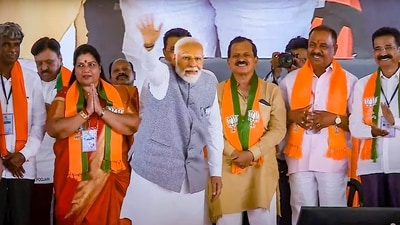 Prime Minister Narendra Modi waves at supporters during an election campaign rally for Lok Sabha polls in Uttara Kannada, Karnataka, on April 28, (PTI)