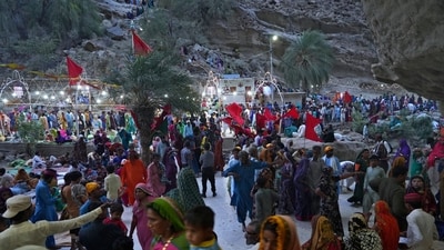 Hindu devotees arrive at an ancient cave temple of Hinglaj Mata to attend an annual festival in Hinglaj in Lasbela district in Pakistan's southwestern Baluchistan province. More than 100,000 Hindus are expected to climb mud volcanoes and steep rocks in southwestern Pakistan as part of a three-day pilgrimage to one of the faith's holiest sites. (AP Photo/Junaid Ahmed) Hindu devotees arrive at an ancient cave temple of Hinglaj Mata to attend an annual festival in Hinglaj in Lasbela district in Pakistan's southwestern Baluchistan province. More than 100,000 Hindus are expected to climb mud volcanoes and steep rocks in southwestern Pakistan as part of a three-day pilgrimage to one of the faith's holiest sites. (AP Photo/Junaid Ahmed)