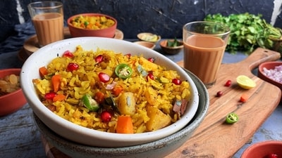 Poha (Maharashtra): A popular breakfast dish in Maharashtra, Poha is made from flattened rice cooked with onions, mustard seeds, turmeric, and curry leaves, garnished with peanuts and coriander. It is often served with a side of spicy green chutney. Poha (Maharashtra): A popular breakfast dish in Maharashtra, Poha is made from flattened rice cooked with onions, mustard seeds, turmeric, and curry leaves, garnished with peanuts and coriander. It is often served with a side of spicy green chutney.
