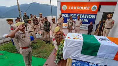 Security personnel pay tribute to the mortal remains of a VDG member Mohammad Sharif, in Udhampur district (PTI) Security personnel pay tribute to the mortal remains of a VDG member Mohammad Sharif, in Udhampur district (PTI)