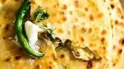 Aloo Paratha (Punjab): Hailing from Punjab, Aloo Paratha is a delicious and filling breakfast option. It is a flatbread stuffed with a spiced potato filling, cooked on a griddle with ghee, and served with fresh yogurt, pickles, and butter. (Pinterest) Aloo Paratha (Punjab): Hailing from Punjab, Aloo Paratha is a delicious and filling breakfast option. It is a flatbread stuffed with a spiced potato filling, cooked on a griddle with ghee, and served with fresh yogurt, pickles, and butter. (Pinterest)