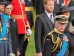 FILE - King Charles III, front right, Camilla, the Queen Consort, Prince Harry and Prince William watch as the coffin of Queen Elizabeth II is placed into the hearse following the state funeral service in Westminster Abbey in central London Monday Sept. 19, 2022. King Charles III has been diagnosed with a form of cancer and has begun treatment, Buckingham Palace says on Monday, Feb. 5, 2024. (AP Photo/Martin Meissner, Pool, File)