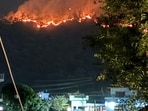 Forest fire raging in Ranibagh area of Uttarakhand’s Nainital district on Saturday night. Forest fire raging in Ranibagh area of Uttarakhand’s Nainital district on Saturday night.