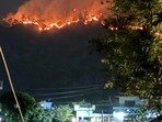 Forest fire raging in Ranibagh area of Uttarakhand’s Nainital district on Saturday night. Forest fire raging in Ranibagh area of Uttarakhand’s Nainital district on Saturday night.