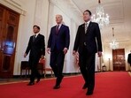 U.S. President Joe Biden escorts Philippines President Ferdinand Marcos Jr. and Japan Prime Minister Fumio Kishida to their trilateral summit at the White House in Washington, U.S., April 11, 2024.  REUTERS/Kevin Lamarque