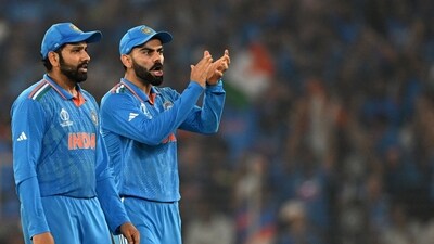 India's captain Rohit Sharma (L) and teammate Virat Kohli (AFP) India's captain Rohit Sharma (L) and teammate Virat Kohli (AFP)